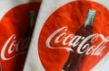 Close up of isolated Coca Cola napkins in napkin dispenser with logo, lettering and bottle