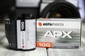 Closeup of Agfa APX black and white 35 mm ISo 100 camera film roll