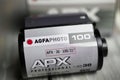 Closeup of Agfa APX black and white 35 mm ISo 100 camera film roll