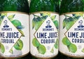 Closeup of bottles Desmond lime juice cordial in shelf of german supermarket