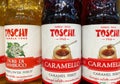 Closeup of bottles italian Toschi syrup in shelf of german supermarket