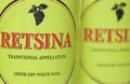 Closeup of greek white wine yellow bottle label Retsina