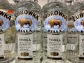 View on bottle labels with logo lettering of zubrowka biala vodka in shelf of german supermarket