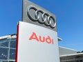 View on isolated Audi lettering and logo sign against blue sky