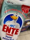 Closeup of bottle toilet cleaner with johnson wc ente logo lettering in shelf of german supermarket