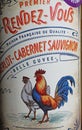 Closeup of french red Merlot Cabernet Sauvignon belle cuvee wine bottle vintage design label Premier Rendez-Vous