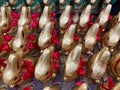 Closeup view from above of group many lindt golden chocolate easter bunnies in shelf of german supermarket