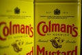 Makro close up of isolated retro design cans original english mustard powder with colmans logo lettering Royalty Free Stock Photo