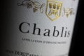 Makro closeup of isolated white wine bottle label with word text chablis