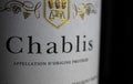 Makro closeup of isolated white wine bottle label with word text chablis