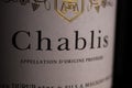 Makro closeup of isolated white wine bottle label with word text chablis