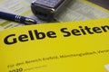 Close up of isolated german yellow phone directory paper book Gelbe Seiten