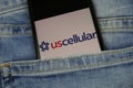 Close up of smartphone screen in blue jeans pocket with logo lettering of american mobile phone provider uscellular