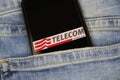 Close up of smartphone screen in blue jeans pocket with logo lettering of italian mobile phone provider Telecom Italia