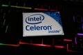 Closeup of smartphone with logo lettering of intel celeron processor cpu on computer keyboard