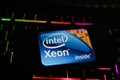 Closeup of smartphone with logo lettering of intel xeon processor cpu on computer keyboard