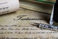 Macro closeup of retro ink pen, old vintage paper with handwritten text for last will testament Royalty Free Stock Photo