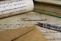 Macro closeup of retro ink pen, old vintage paper with handwritten text for last will testament Royalty Free Stock Photo