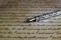 Macro closeup of retro ink pen, old vintage paper with handwritten text Royalty Free Stock Photo