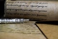 Macro closeup of retro ink pen, old vintage paper with handwritten text Royalty Free Stock Photo