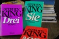 View on covers of Stephen King novels with pile of books background Royalty Free Stock Photo