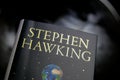 View on isolated book cover of Stephen Hawking with blurred world globe background Royalty Free Stock Photo