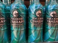 Close up ofgreen russian standard vodka in malachite design bottles in shelf of german supermarket