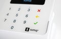 Closeup of isolated white mobile sumup air card payment reader terminal with keyboard Royalty Free Stock Photo