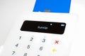 Closeup of isolated white mobile sumup air card payment reader terminal with keyboard Royalty Free Stock Photo