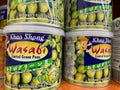 Close up of Khao Shong wasabi coated green peas cans in shelf of german supermarket