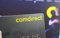 Closeup of on single comdirect banking card, blurred website background