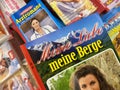 View on pile light fiction paper magazines with focus on alpine romance magazine