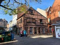 View over square on medieval houses and church in autumn