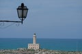 Vieste Lighthouse and street light, Island of Santa Eufemia, Vieste, Gargano, Italy Royalty Free Stock Photo