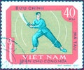 Postage stamp printed in Vietnam shows the national sport of martial arts - Scimitar fighting, from the series `Sports