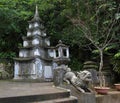 Vietnam, Danang Marble mountains- January 2017: A small pagoda and a stone lion in the complex structures of the Marble Mountain Royalty Free Stock Photo