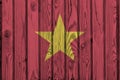 Vietnam flag depicted in bright paint colors on old wooden wall. Textured banner on rough background