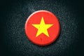 Vietnam flag. Round badge, on a dark background. Signs and Symbols