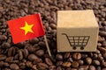 Vietnam flag with shopping cart on coffee bean, import export trade online commerce concept Royalty Free Stock Photo