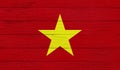 Vietnam flag on a wooden texture.