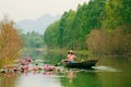 Vietnam girl in traditional costume rowing boat for travel Royalty Free Stock Photo