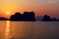 Llimestone karsts silhouette at sunset panorama, Halong Bay Vietnam Royalty Free Stock Photo