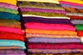 Close up piles of fabric for sale at Xuan Market Hanoi Vietnam