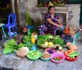 Lady selling fruit and vegetables in Hanoi Vietnam