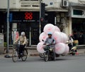 Gentleman is carrying a 5 large sacks of bubble wrap on Moped, Hanoi Vietnam 