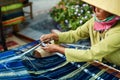 VIETNAM, HO CHI MINH - Vietnamese Woman Weaving Yarn On Street