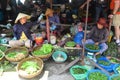 Close up of ladies selling vegetables at market in Hoi An Vietnam 