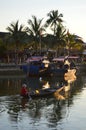 Fishing boats on the Thu Bon River at sunset