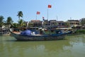 Scenic shot of large fishing boats on the Thu Bon River Hoi An Vietnam 