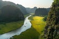 Vietnam landscape. Rice field with curve river and surrounding mountains in Tam Coc, Ninh Binh Royalty Free Stock Photo